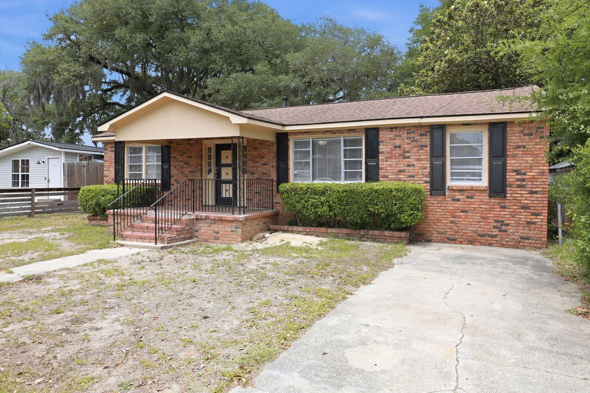 Front of the brick ranch on Spruce Boulevard
